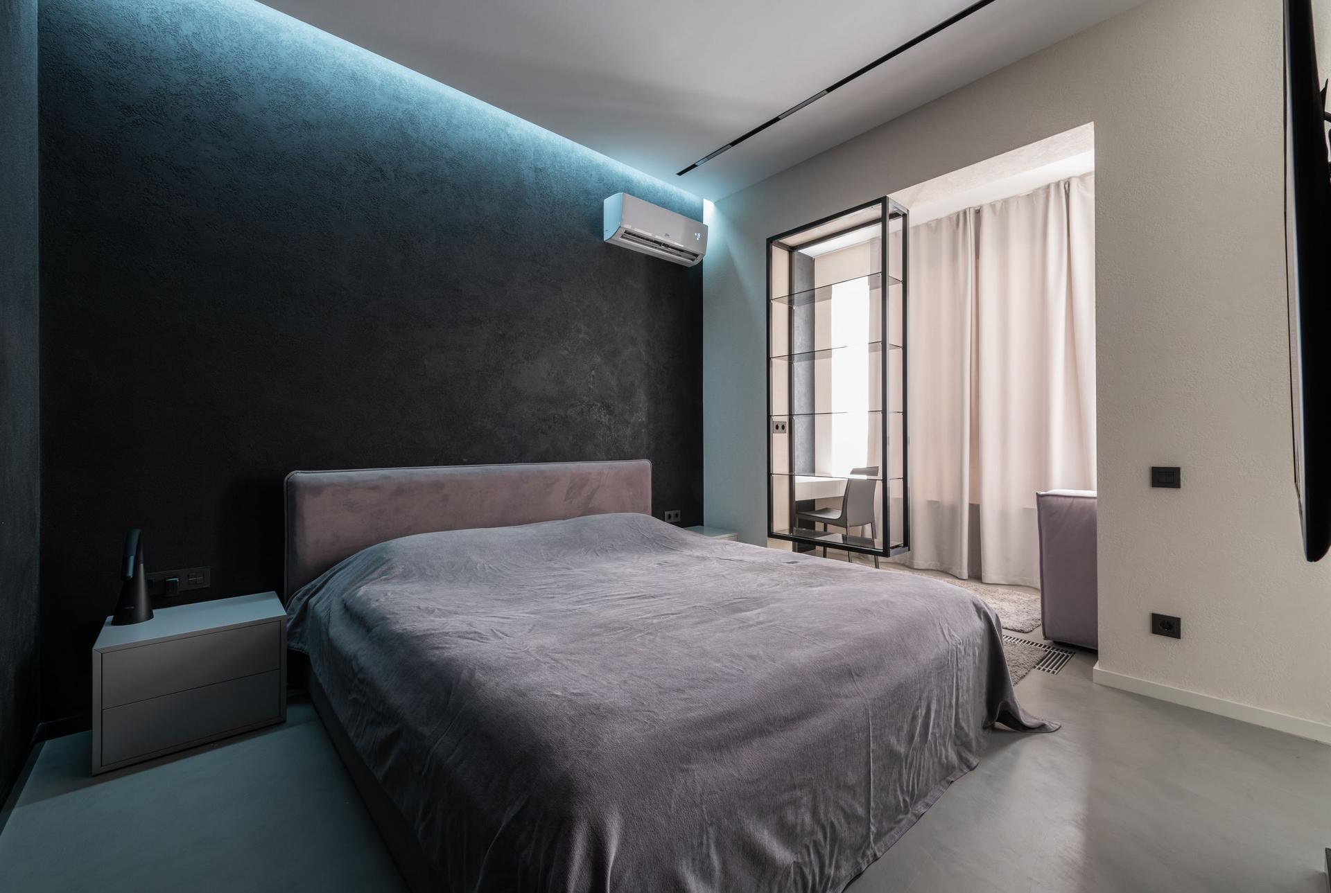 Bedroom with a ductless mini split mounted high on the wall
