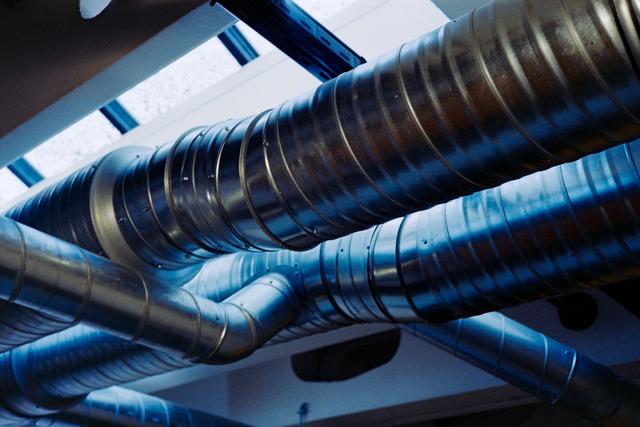 Runs of round metal spiral ductwork overhead