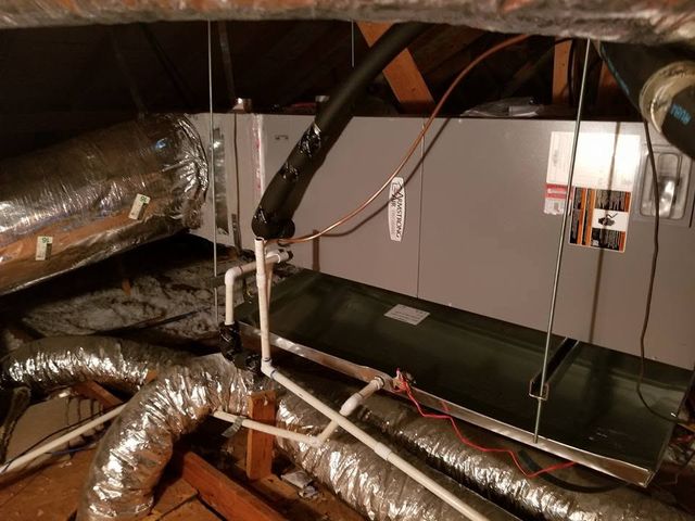Installed attic air handler with copper line set and drain pan
