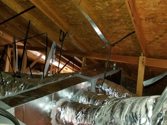 Sheet metal plenum and insulated flex duct runs in an attic