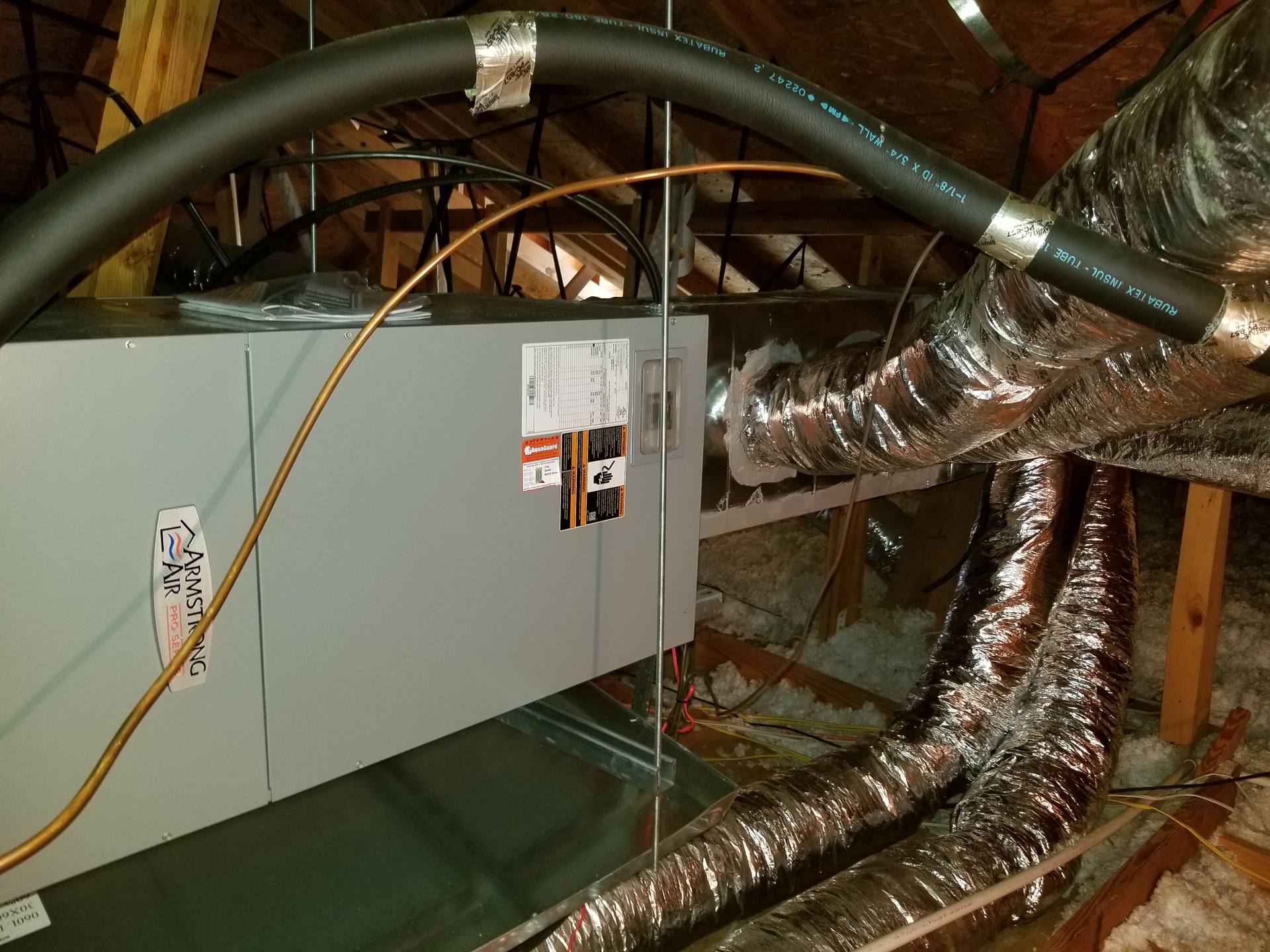 Armstrong Air furnace and air handler installed in an attic with insulated flex duct runs