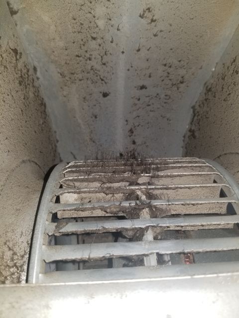 Dust and debris built up inside a return air duct