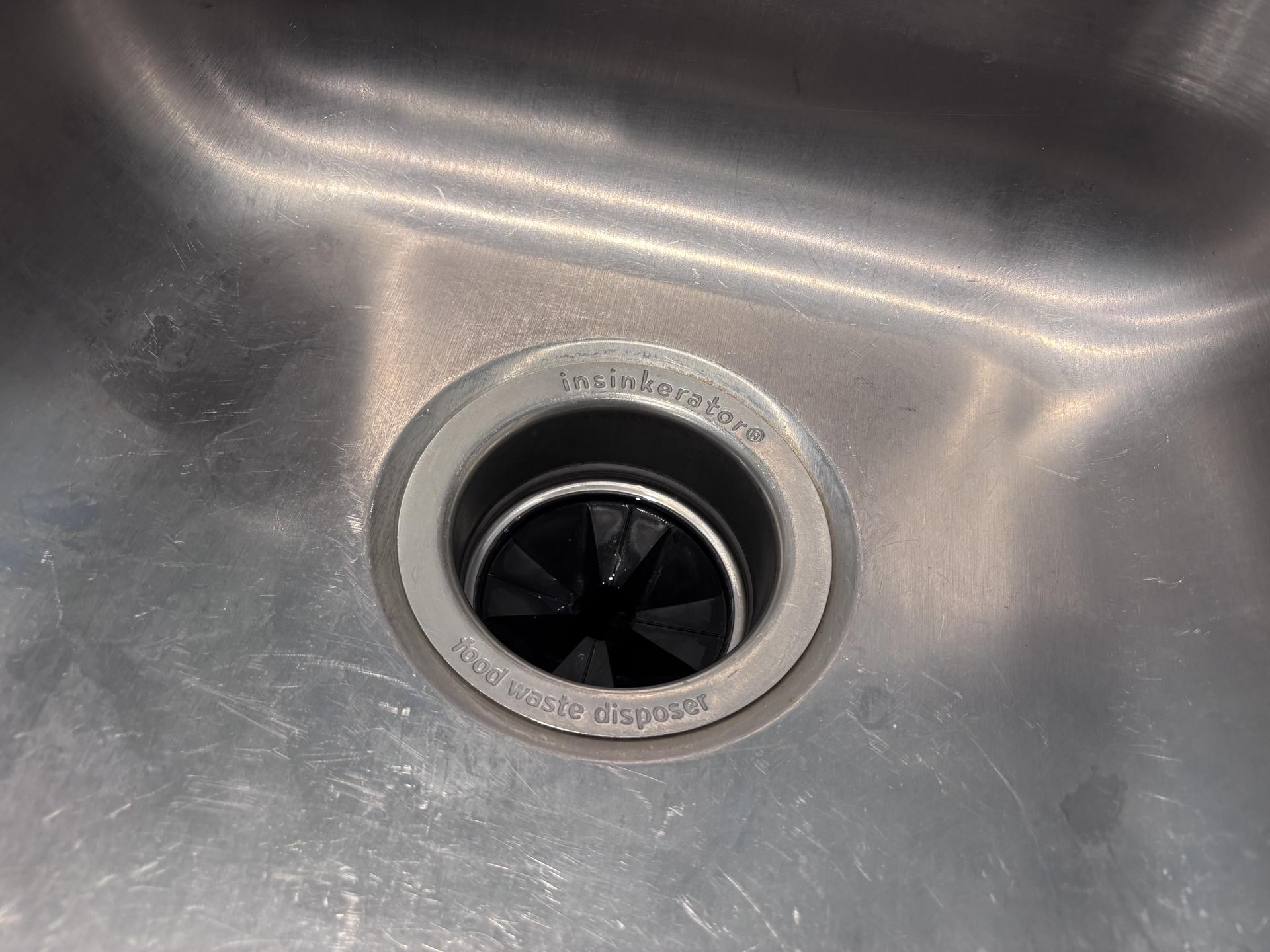 Drain strainer in a stainless steel kitchen sink