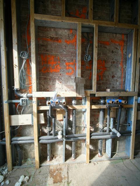 Water supply lines exposed inside an open wall