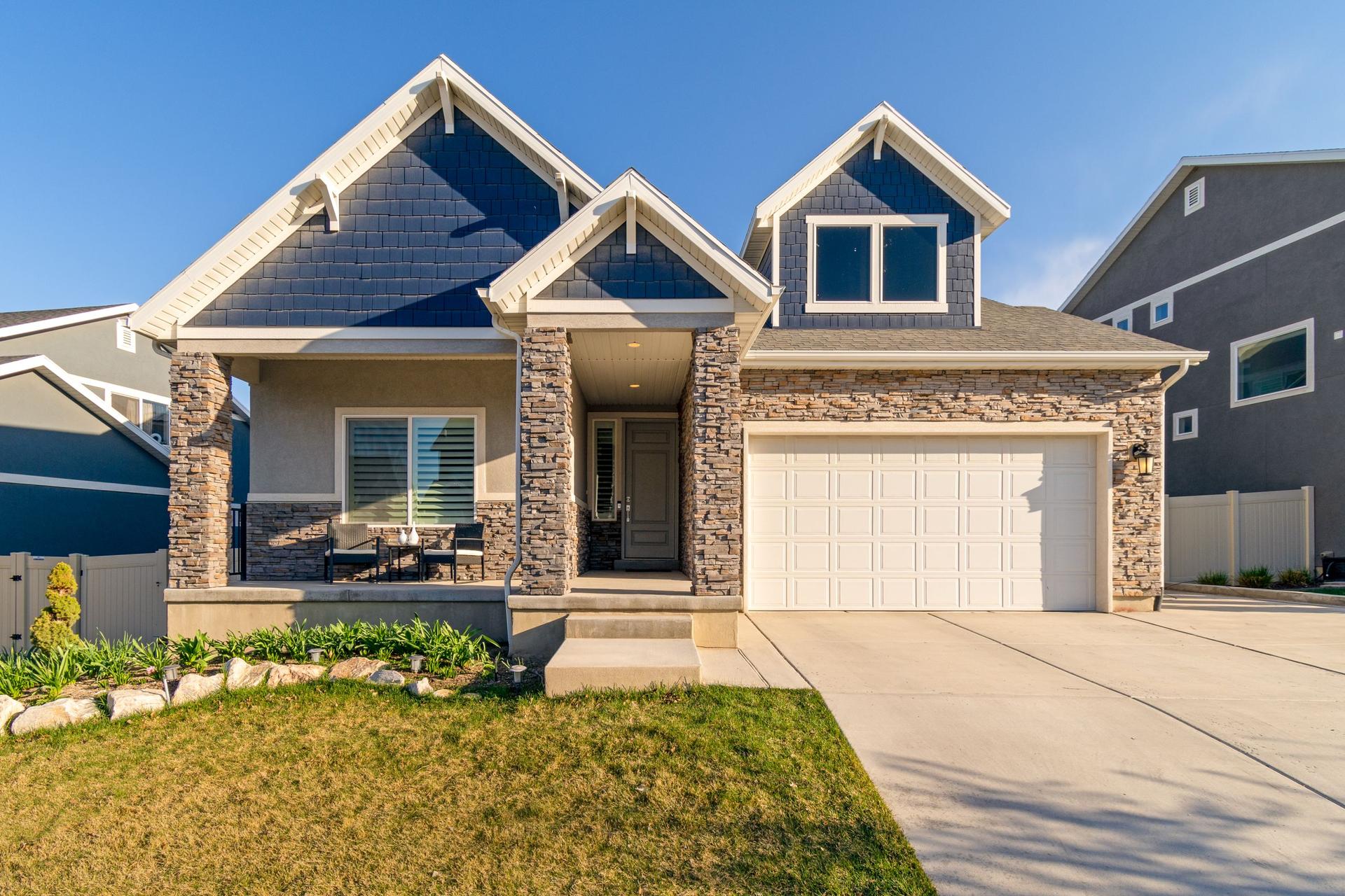 Suburban home with a stone front and a two car garage