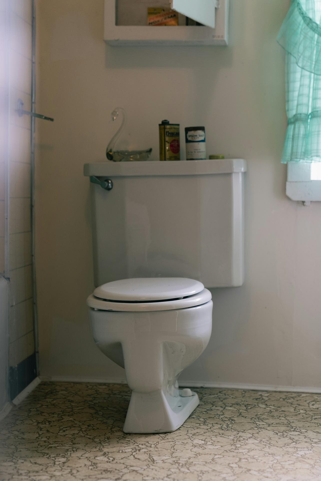 White toilet in a small bathroom